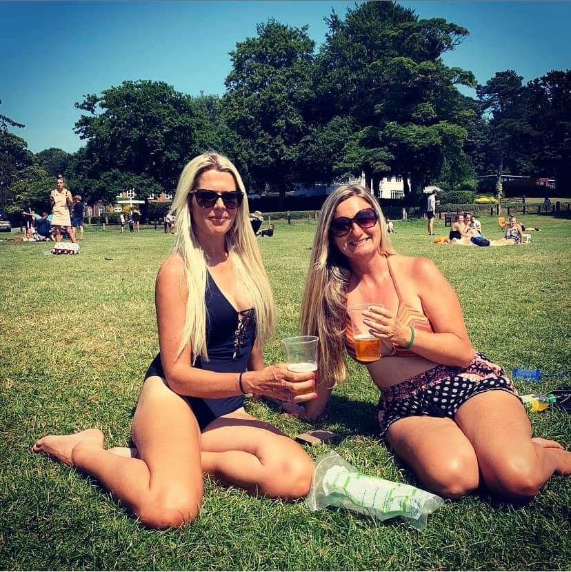Friends enjoying a beer on Coltishall Green